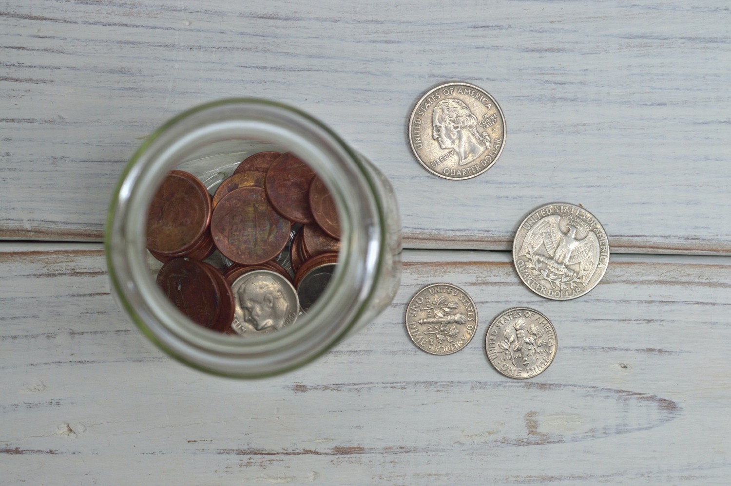 A glass jar of coins.